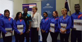 Minister Cash with graduates at Sodexo Traineeship graduation