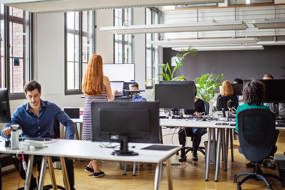 People working at a busy open plan office