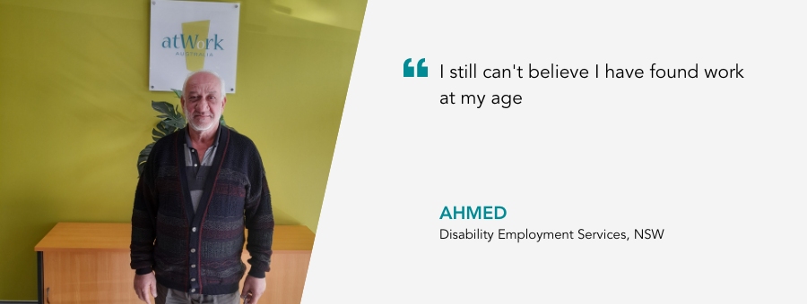 Ahmed stands proudly in the atWork Australia office. Quote reads I still can’t believe I have found work at my age, said Ahmed.