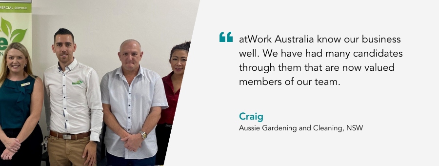 Team members from Aussie Gardening and Cleaning stand in front of a table. Quote reads atWork Australia know our business well. We have had many candidates through them that are now valued members of our team